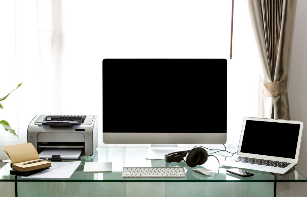 modern home office with computer and labtop
